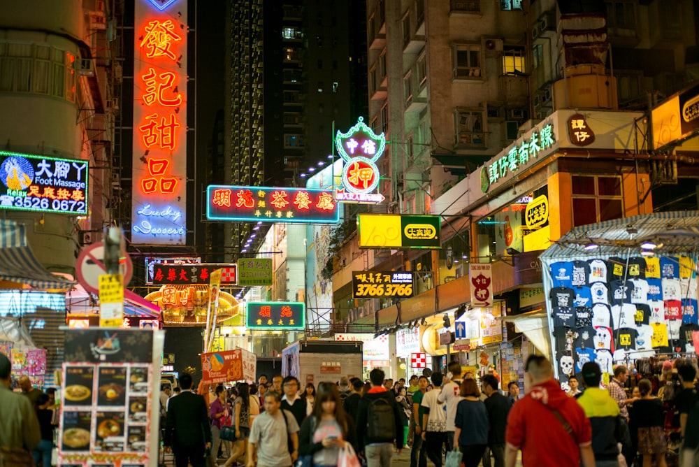 people walking on street during nighttime