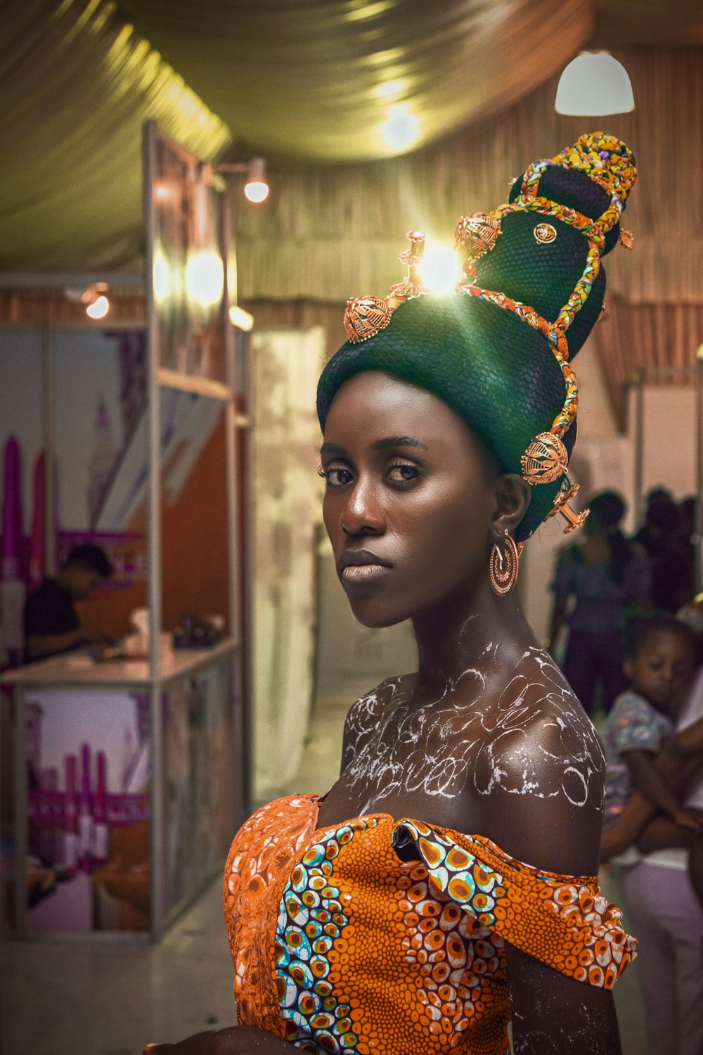 woman in green and gold crown