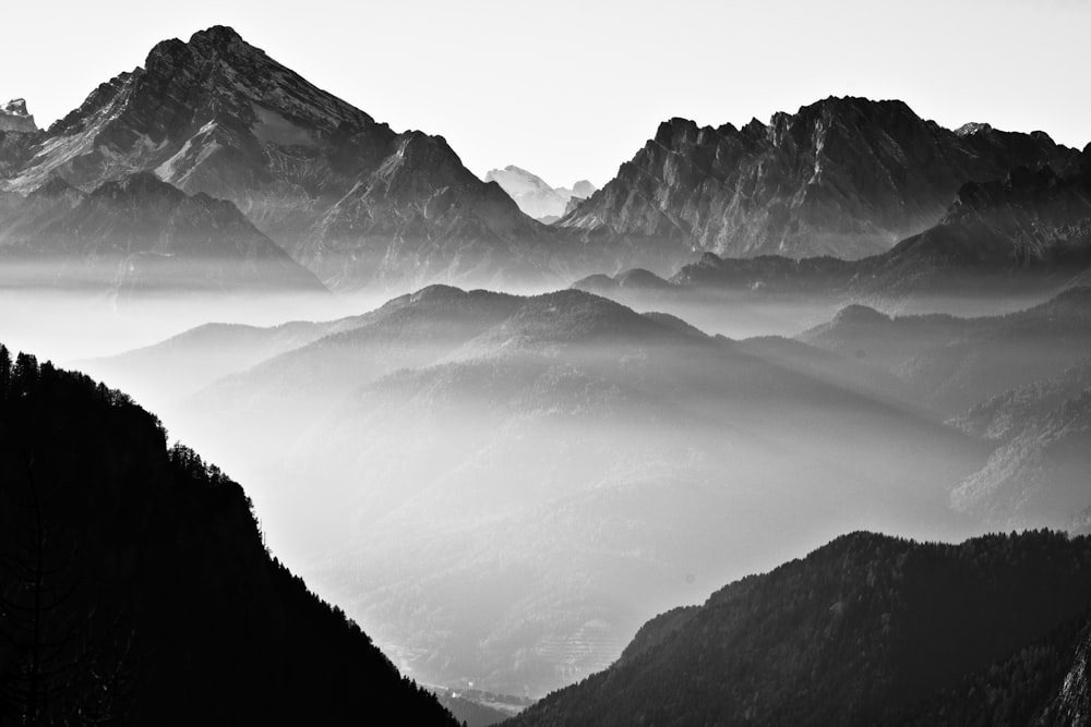 black and white mountains under white sky