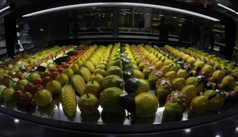 green and yellow fruits on display