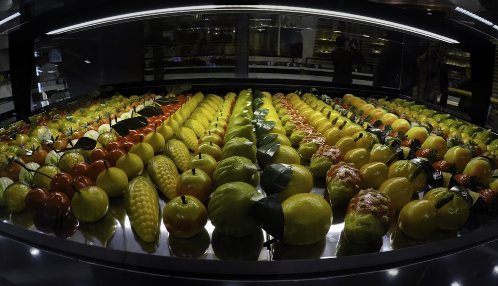 green and yellow fruits on display