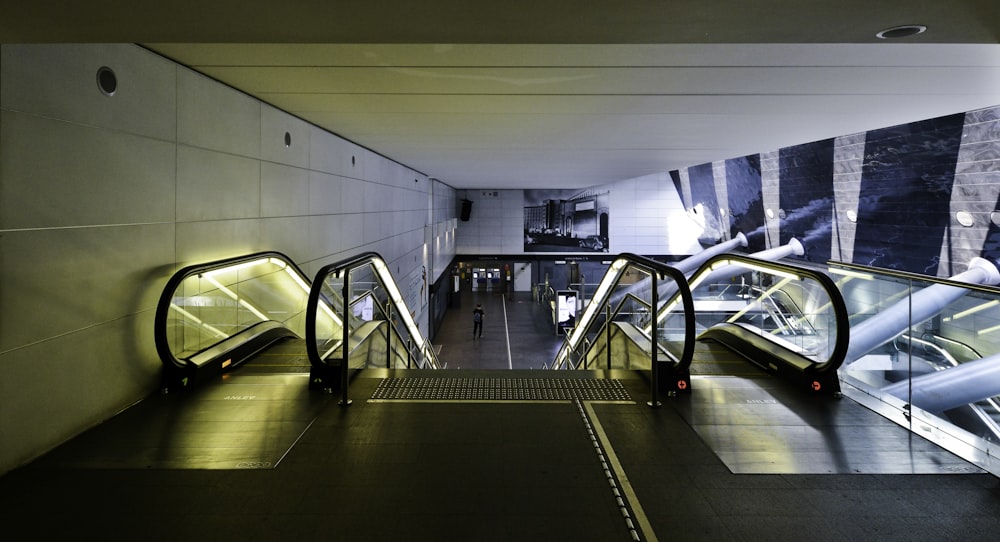 black and white escalator inside building