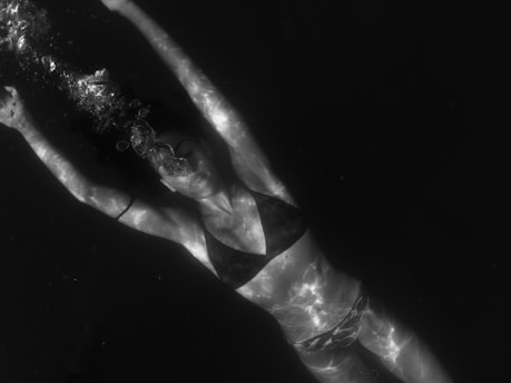 person deep in water therapy hot tub guy diagnosis service repair maintenance sales and service