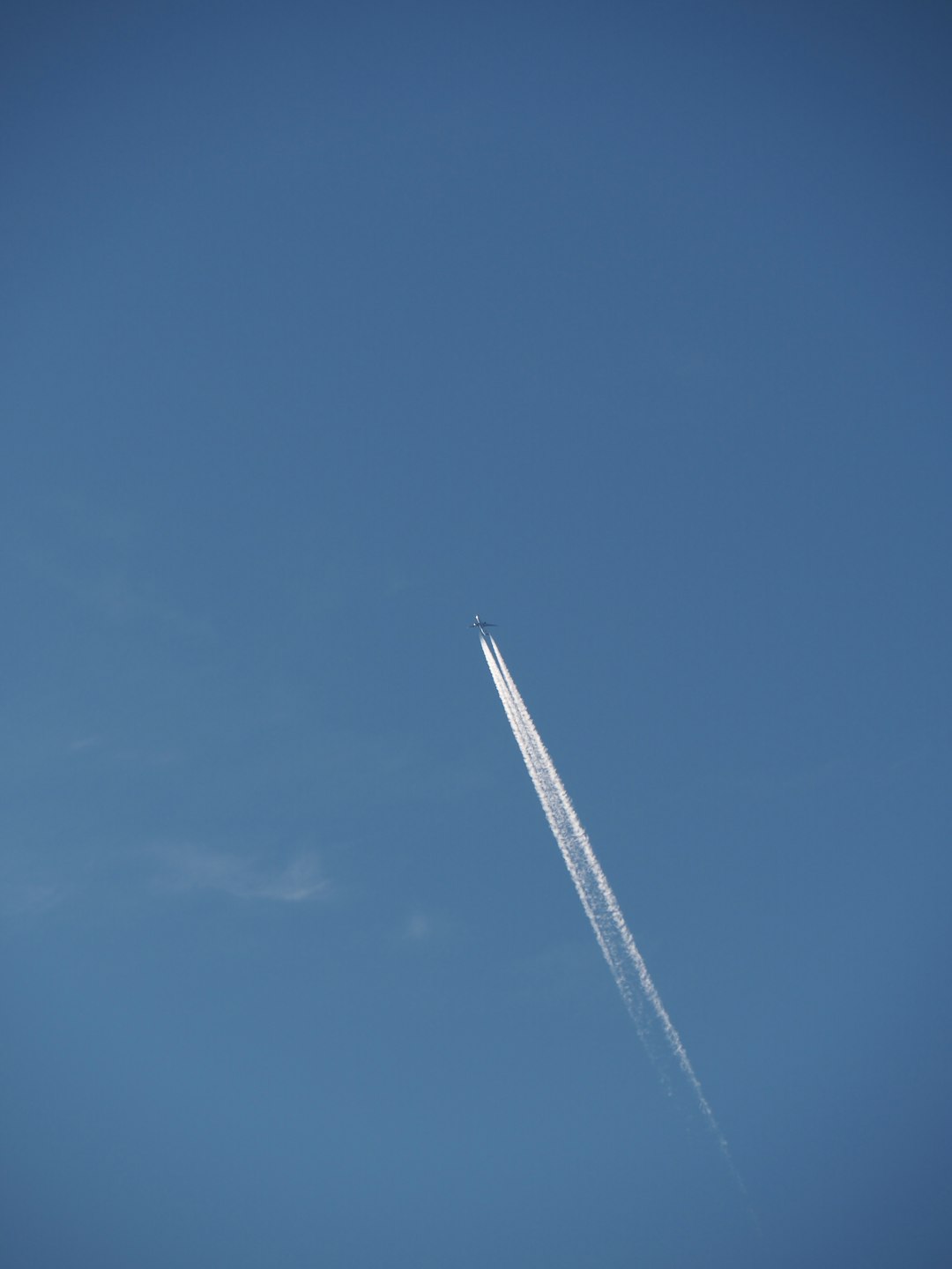 white plane in the sky during daytime