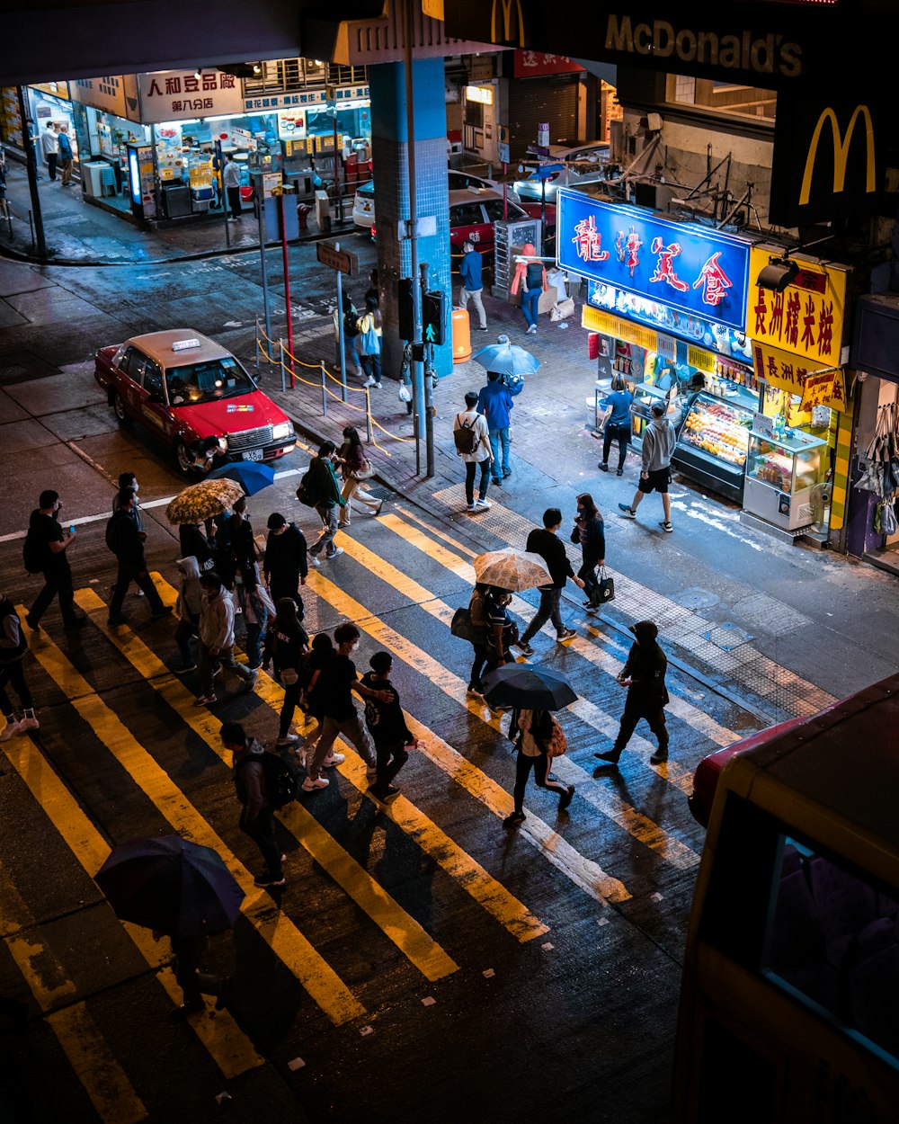 people walking on pedestrian lane during night time