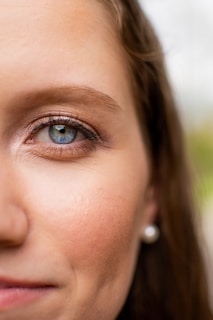 woman with blue eyes and silver nose piercing