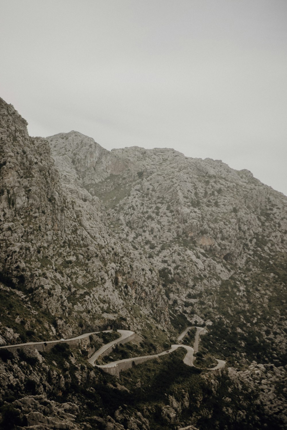 brown wooden fence on rocky mountain during daytime