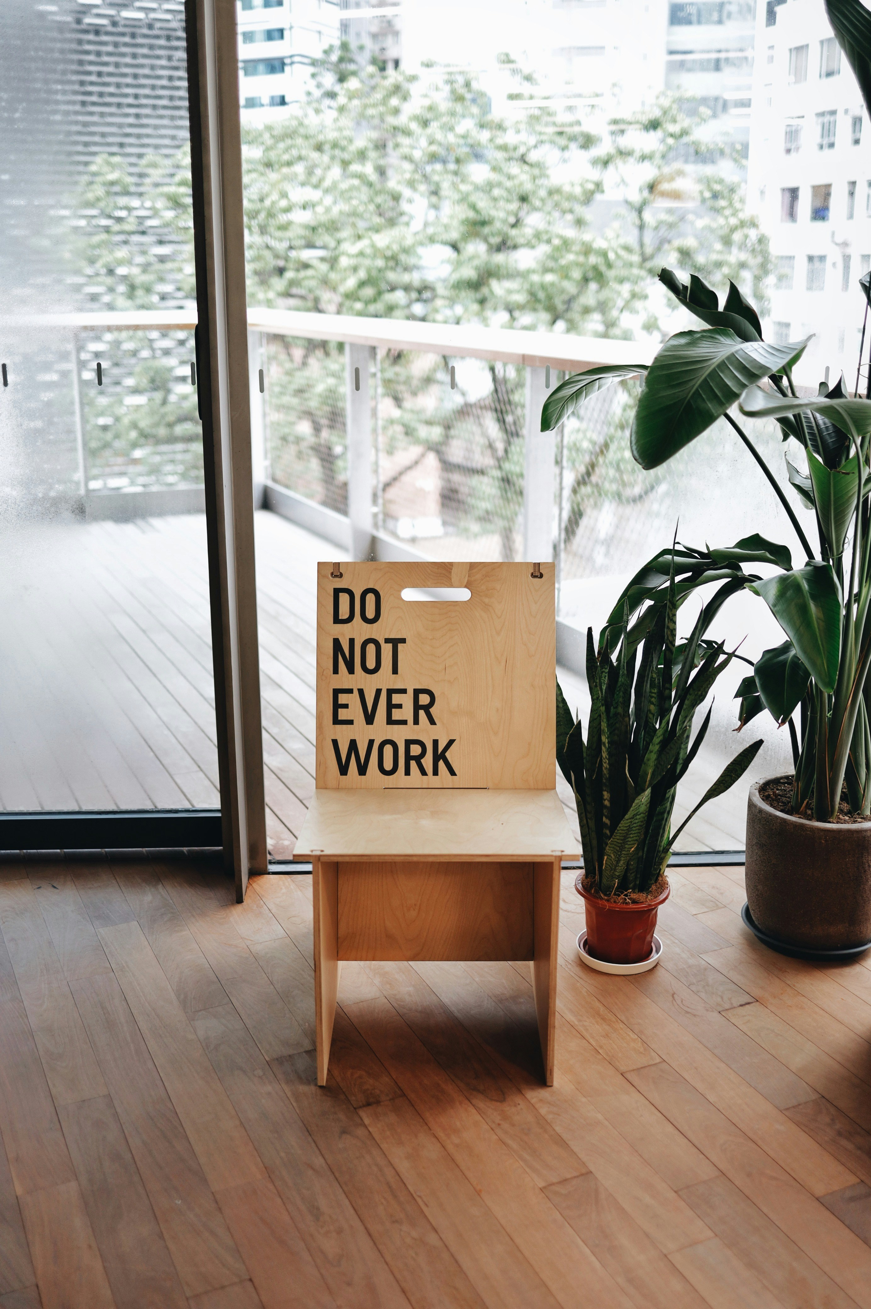 brown wooden table with green plant