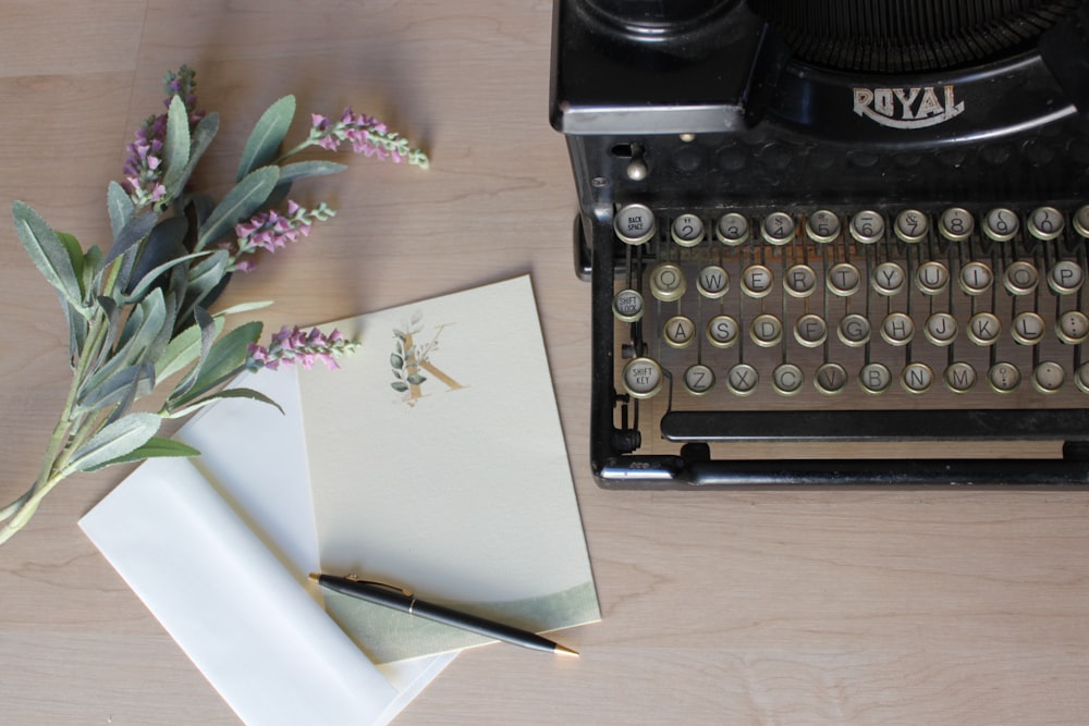 white printer paper on black typewriter