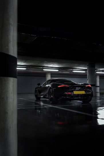 black sports car in a parking lot