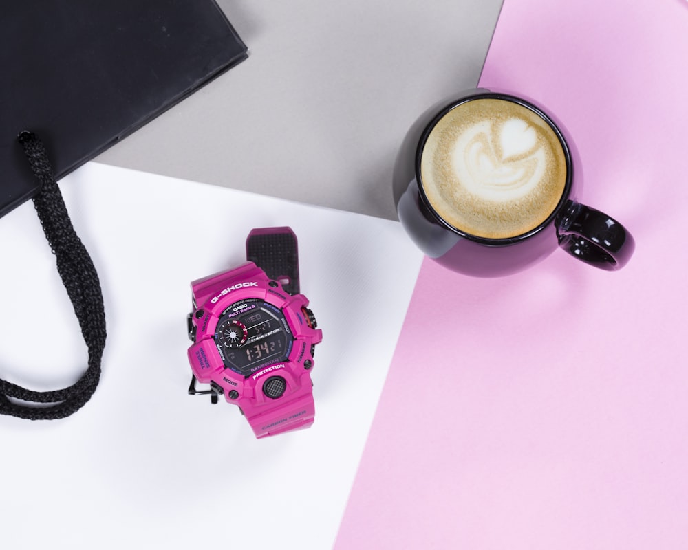 pink and black digital watch