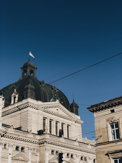white and brown concrete building under blue sky during daytime