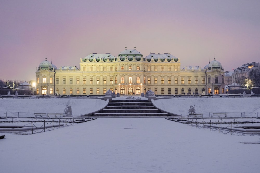 a large building with a lot of snow on the ground