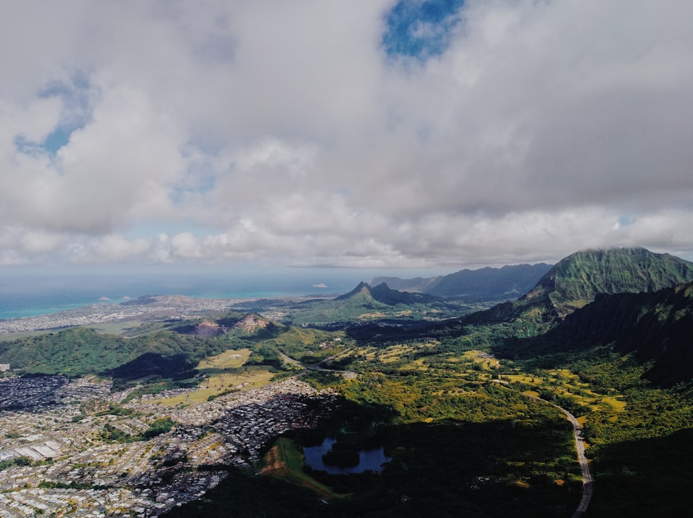 green mountains under white clouds during daytime