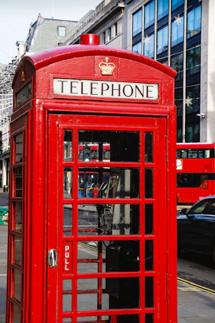 red telephone booth during daytime