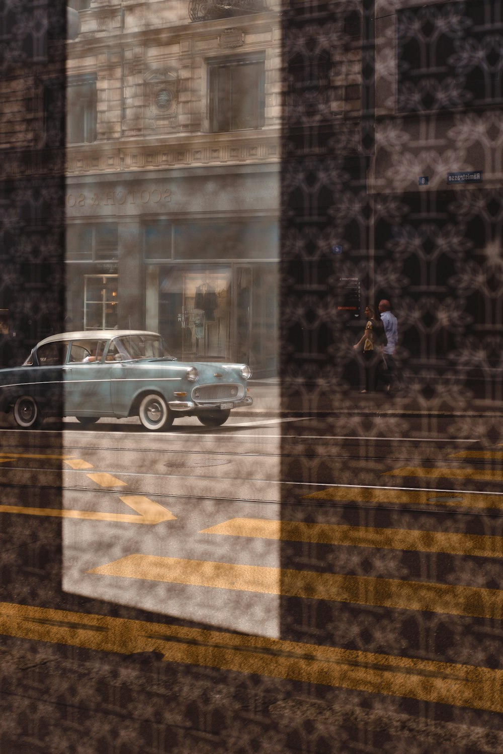 grey suv parked beside black and yellow concrete building