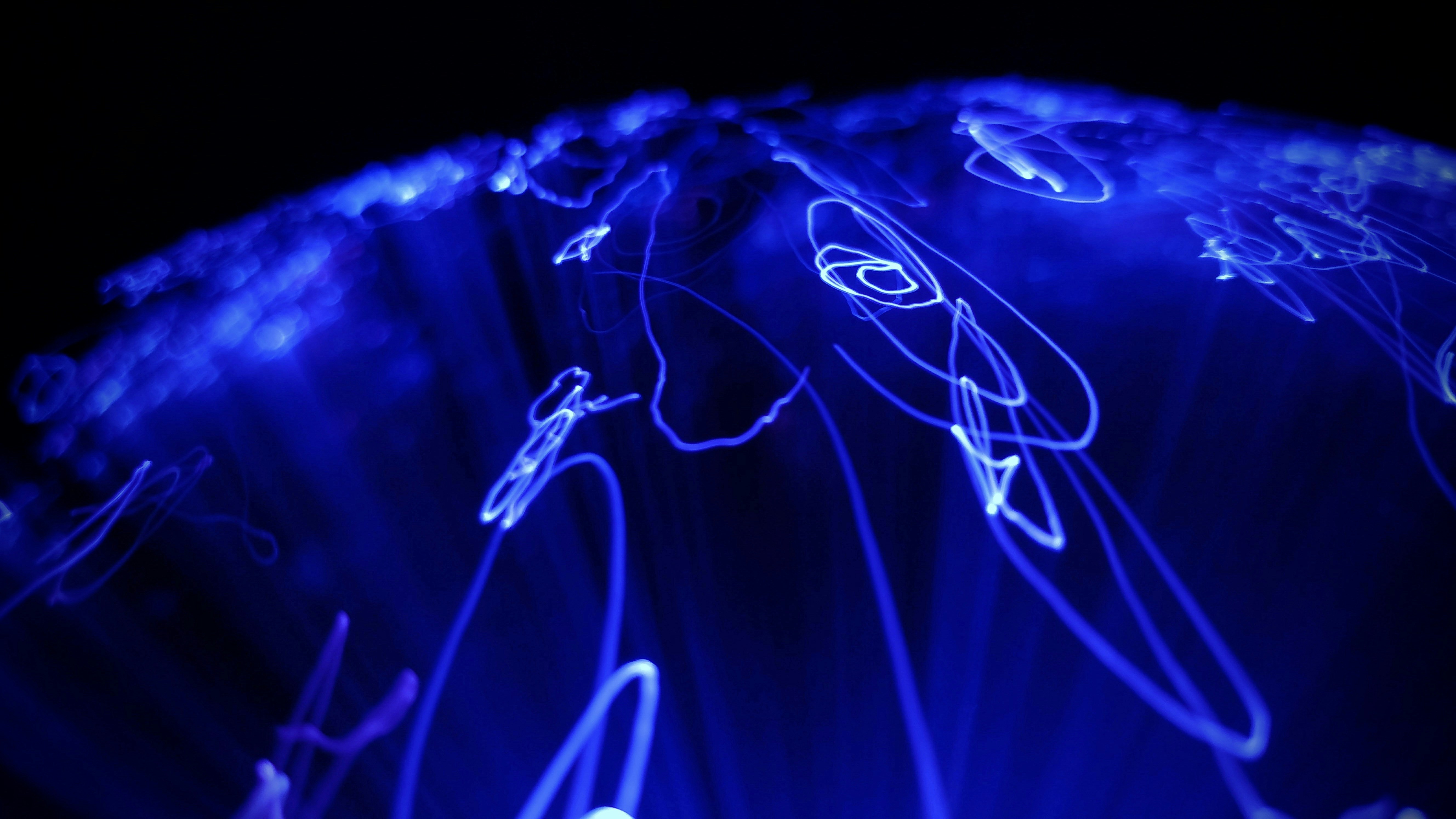 Abstract dark photography with light trails and bokeh, minimal editorial aesthetic