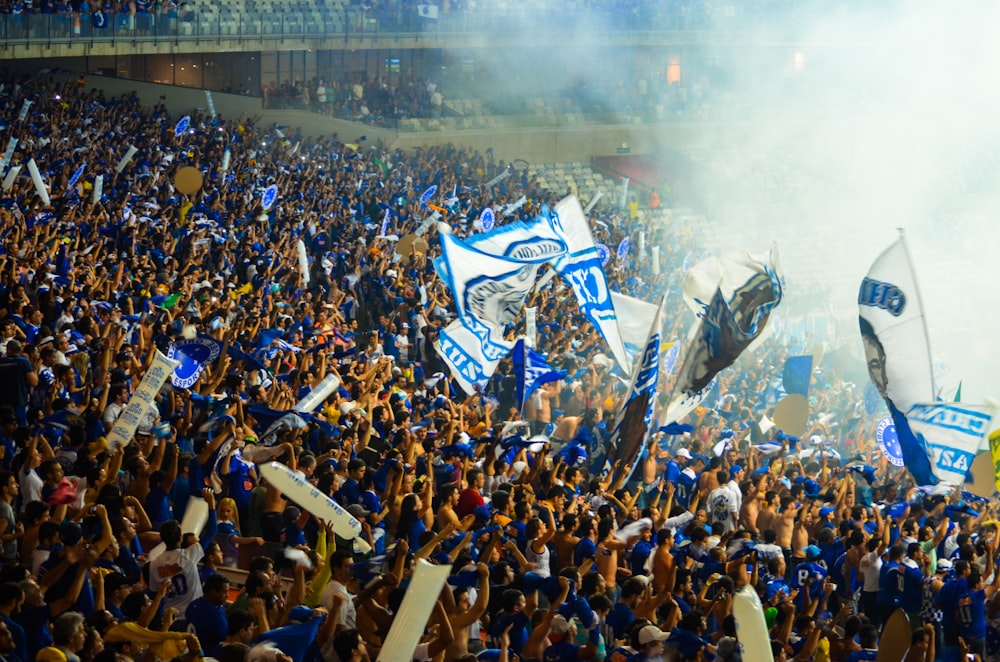 people in blue and white uniform on stadium