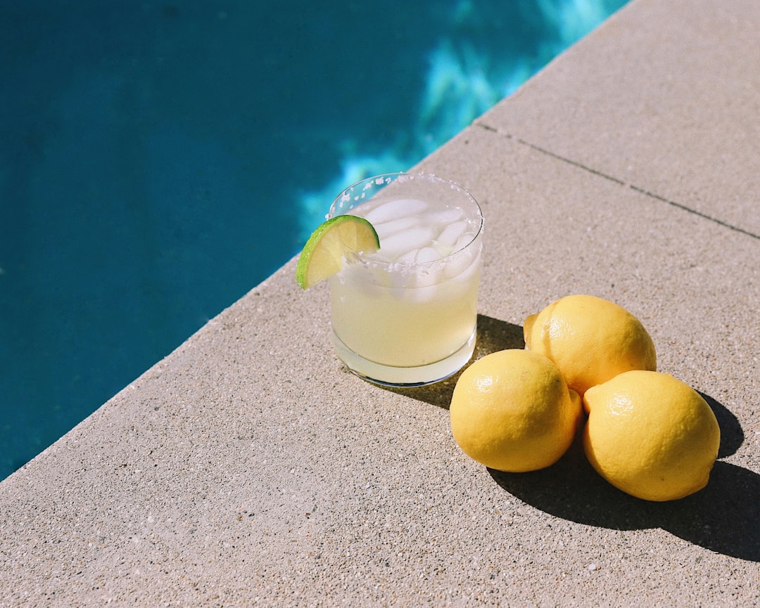 yellow round fruits on gray table