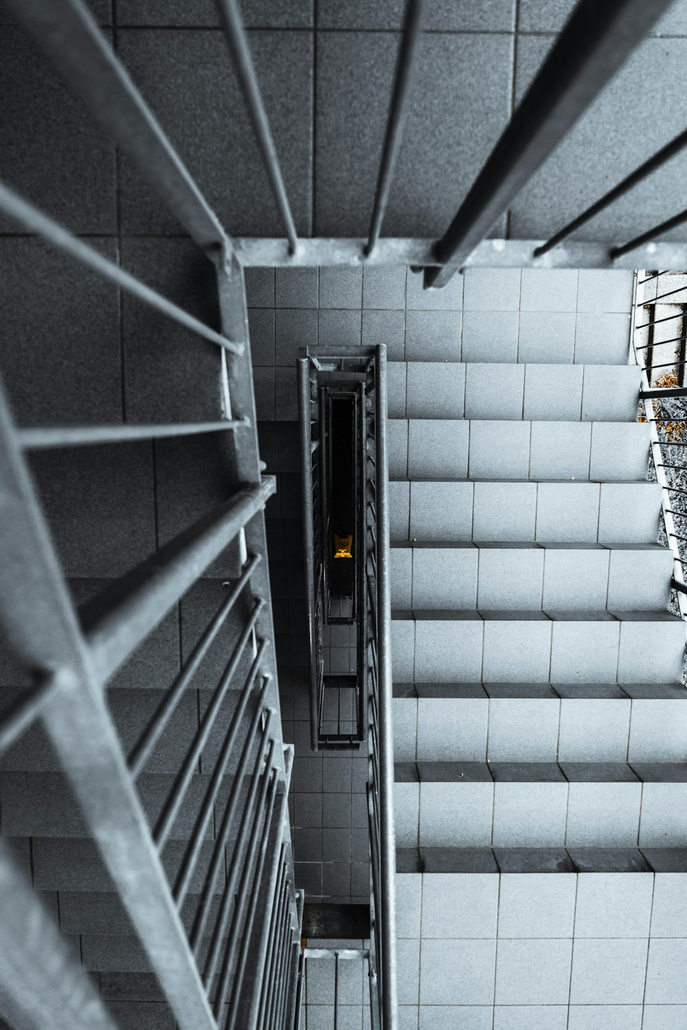 black and white staircase in a tunnel