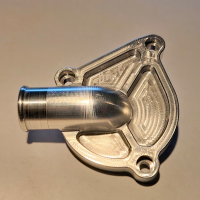 Close-up of a shiny aluminum die casting mold with intricate details.