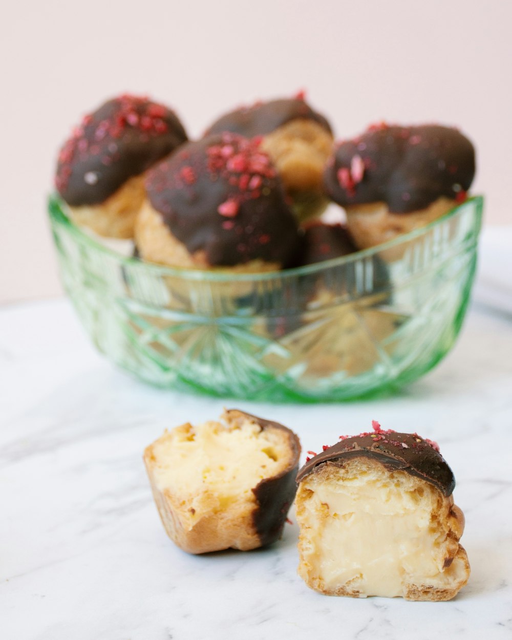 brown and black pastries on green ceramic bowl