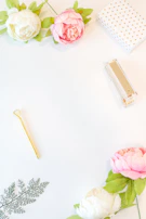 An inviting flat lay of Warmleaf’s signature stationery products surrounded by dried flowers and soft fabric.