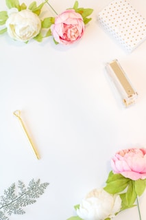 Artistic flat lay of inwaste’s design-led items paired with fresh greenery and minimalist stationery.