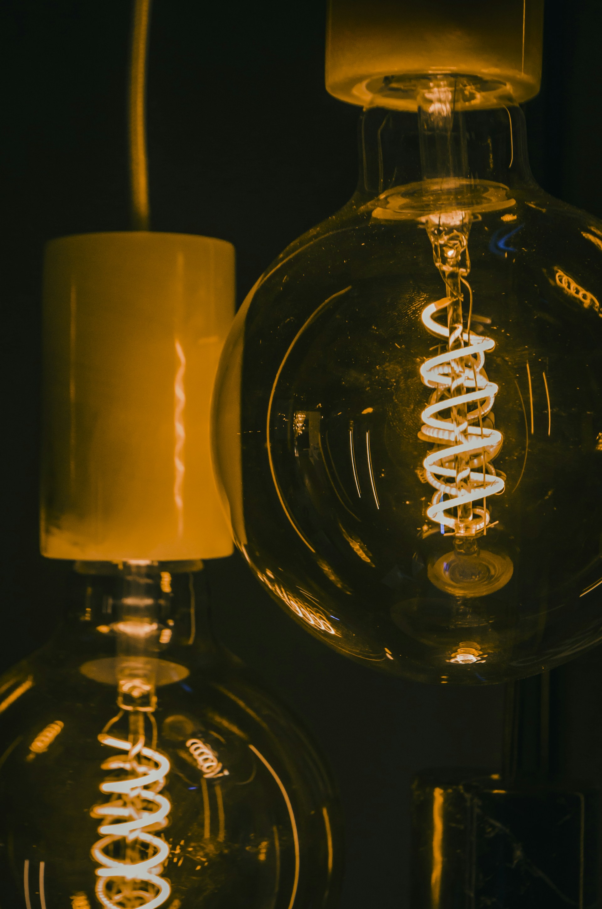 a close up of a light bulb in a dark room