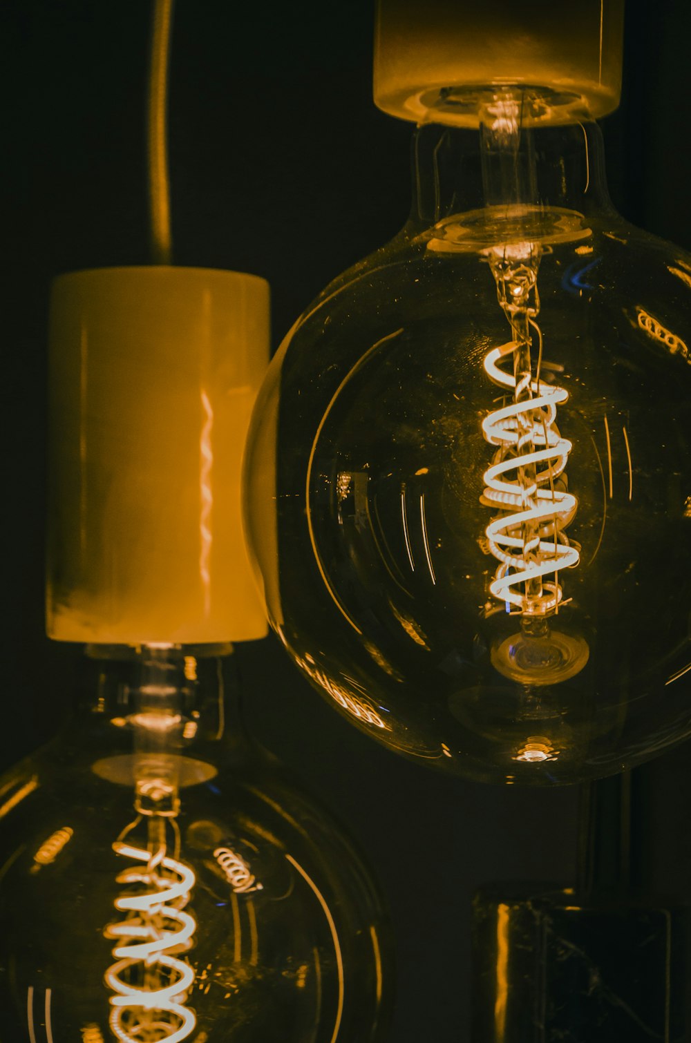 a close up of a light bulb in a dark room
