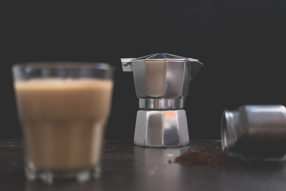 silver and brown coffee pot