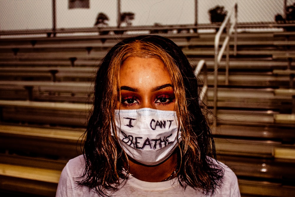 woman in white crew neck shirt with white face mask