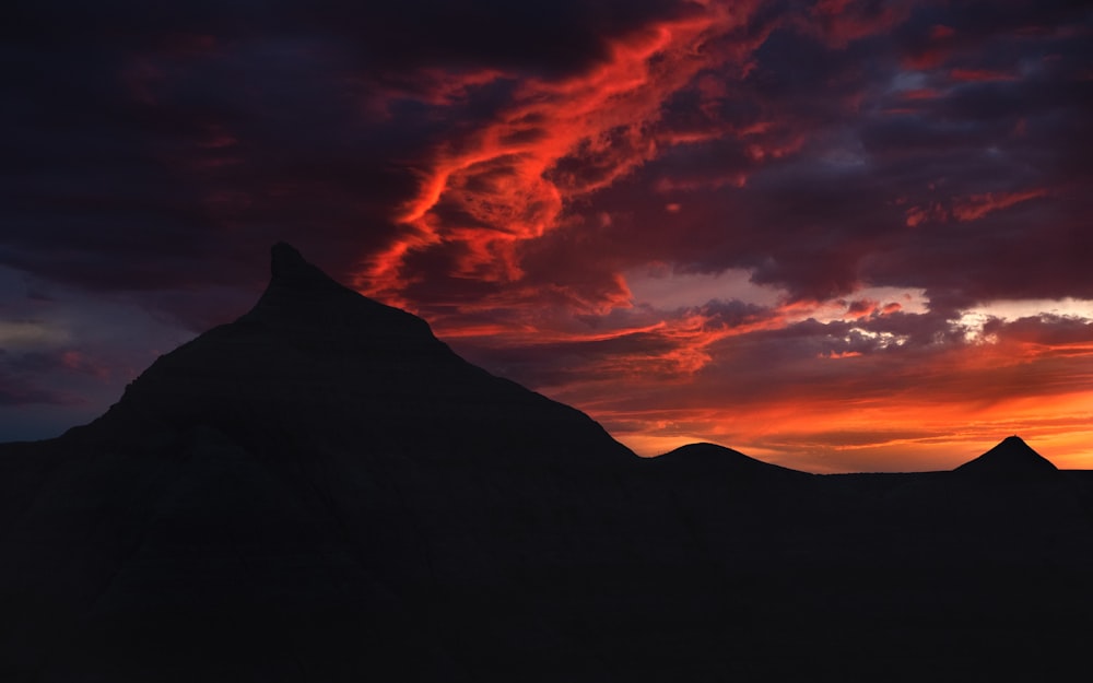 silhouette of mountain during sunset