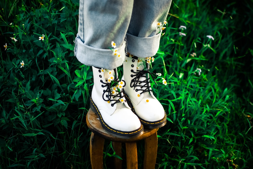 person in black and white high top sneakers