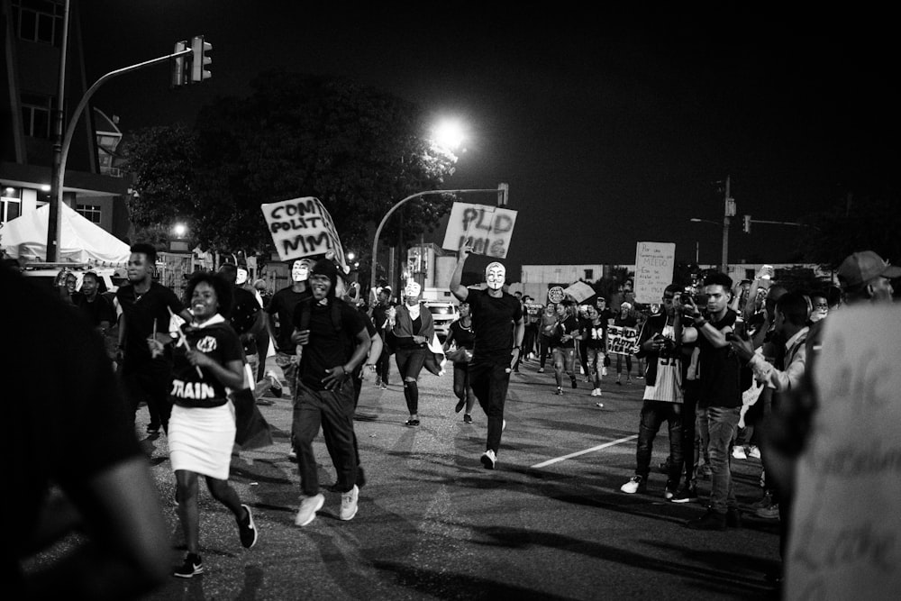 grayscale photo of people walking on street