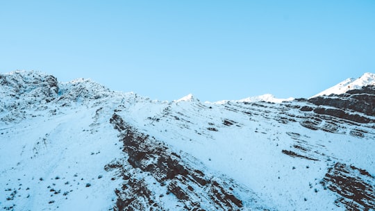 snow covered mountain during daytime in Chaloos Iran