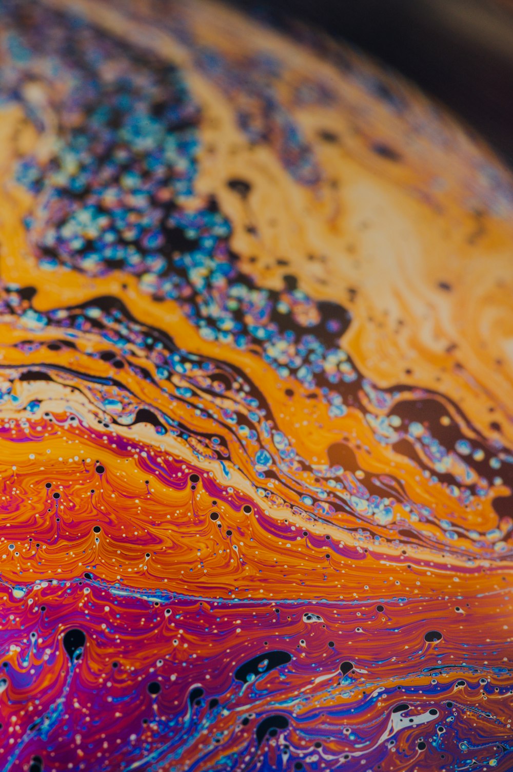 a close up of a colorful painting on a table