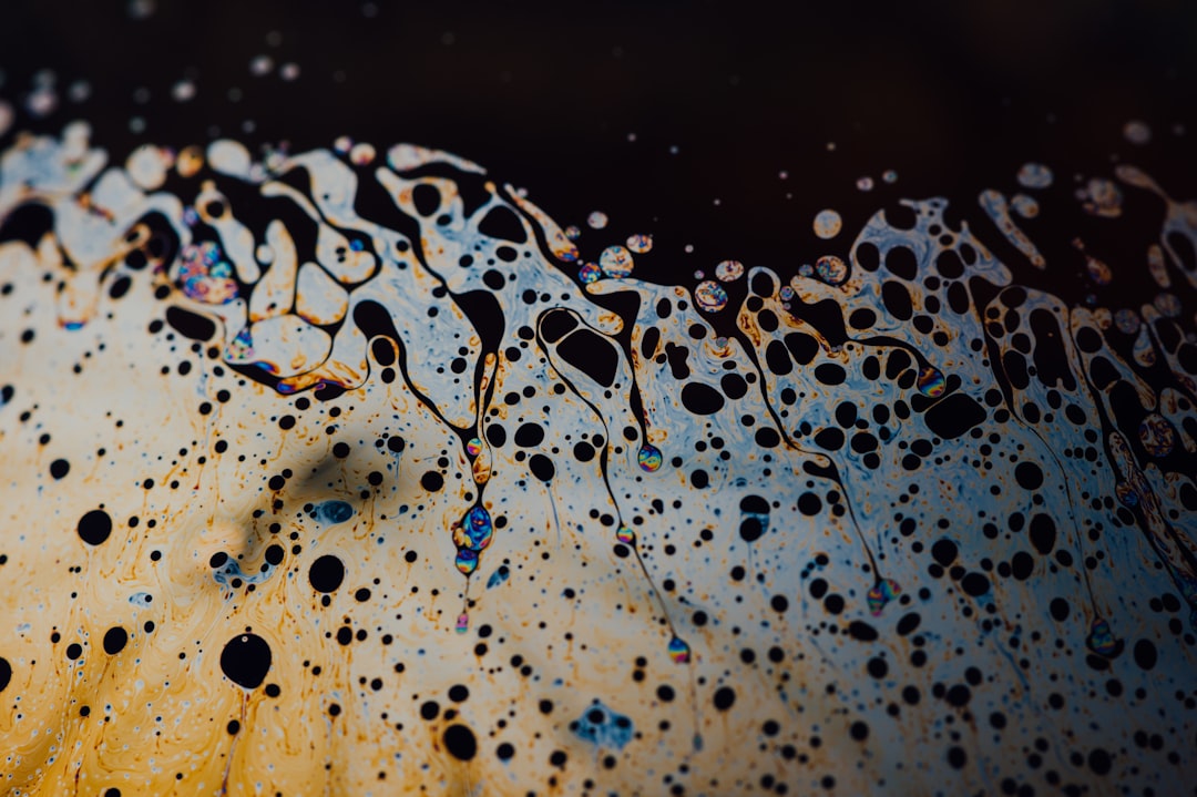 water droplets on brown wooden surface