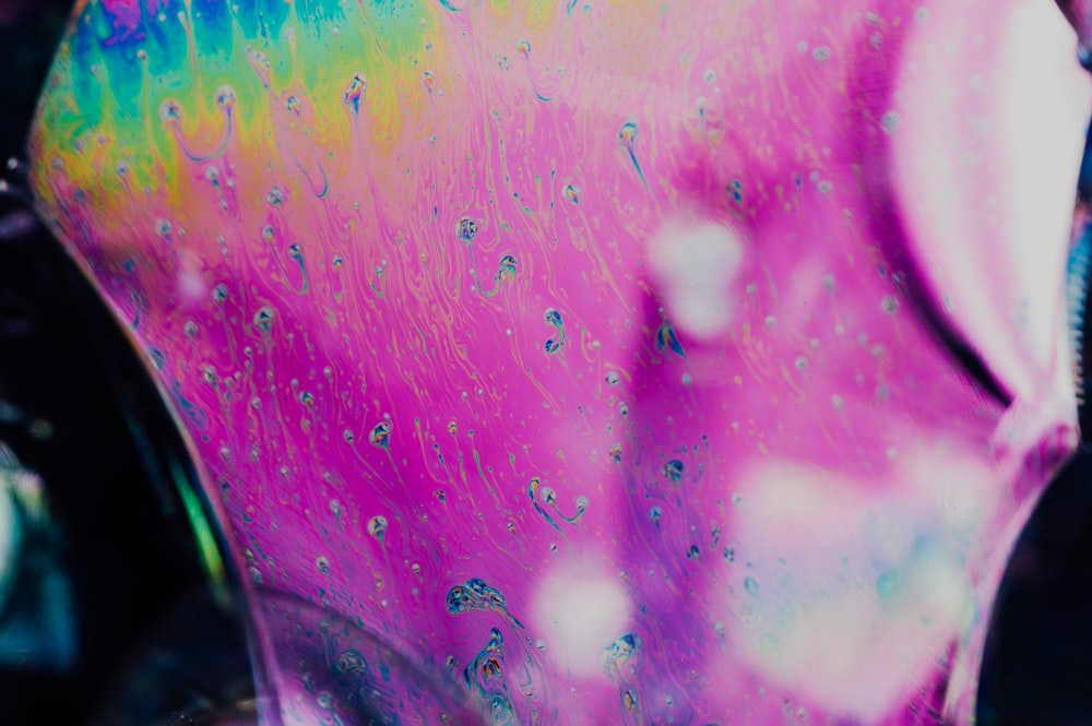 a close up of a glass vase with liquid on it