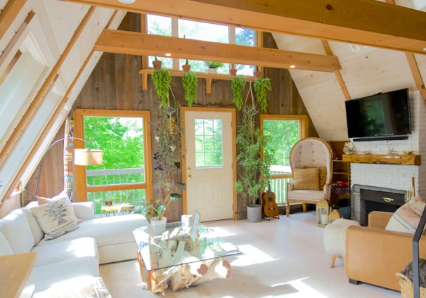 white couch near brown wooden door