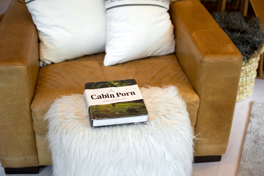 black and white book on white fur textile