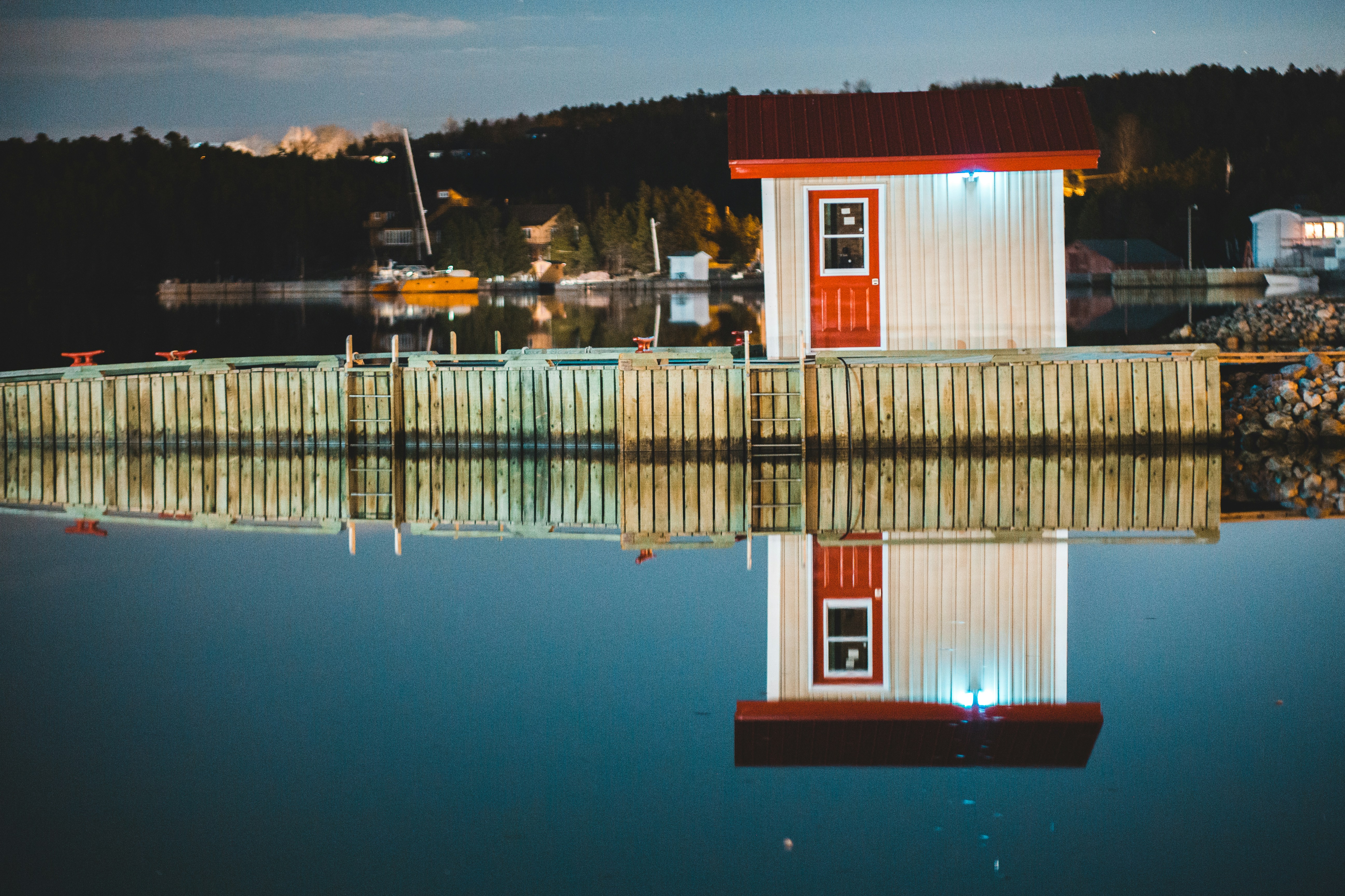 Red and white house near body of water during daytime photo – Free ...