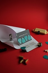 silver and gold round coins on white paper