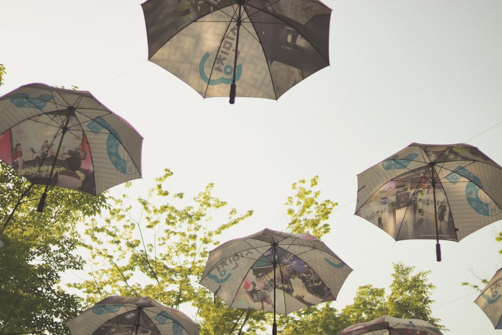 low angle photography of umbrella umbrellas under white sky during daytime