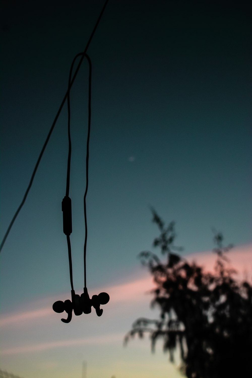 silhouette of string lights during sunset