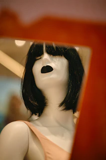 black haired woman in white tank top