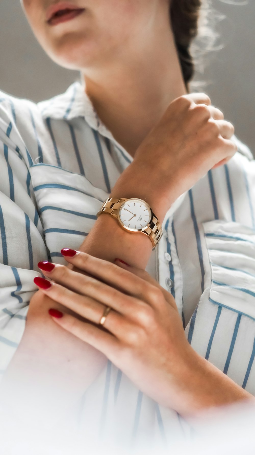 person wearing silver and gold analog watch