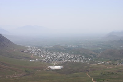 Wide aerial panorama of Serra da Mantiqueira with scattered farms and valleys.