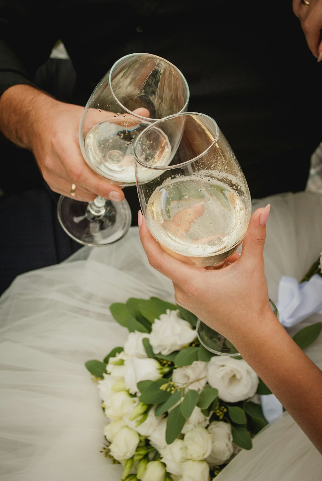 person holding clear drinking glass