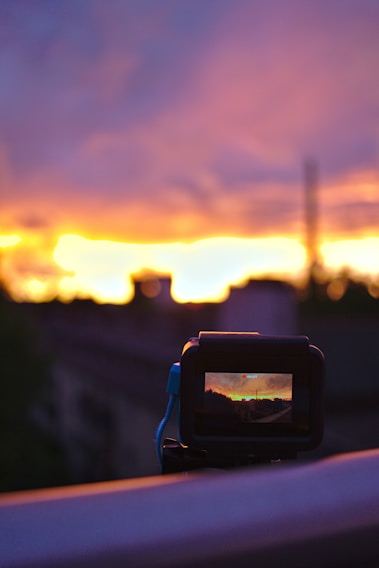 A cinematic camera capturing a dramatic outdoor event at sunset.